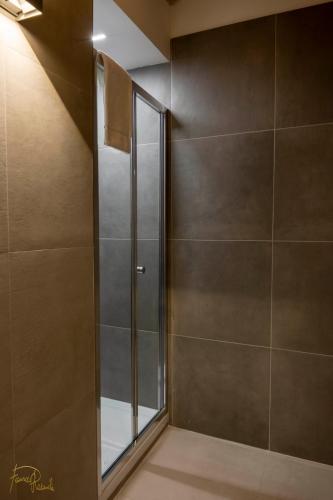 a shower with a glass door in a bathroom at ALLA QUERCIA - CENTRO STORICO in Monterotondo