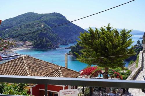 a view from a balcony of a town with a lake at Saint george Hotel Parga in Parga