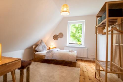 Кровать или кровати в номере Ferienhäuser Rosalinn und Felinchen