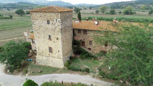 an aerial view of a stone building in a field at Castello di Casallia in Vetulonia