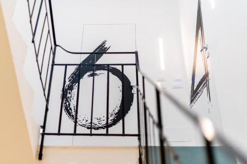 a metal cage with a globe on a staircase at B&B A C-Caste in Monopoli