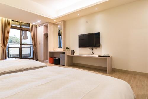 Katil atau katil-katil dalam bilik di Rhino Guest House