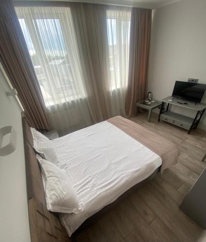 Кровать или кровати в номере Pallada Hotel