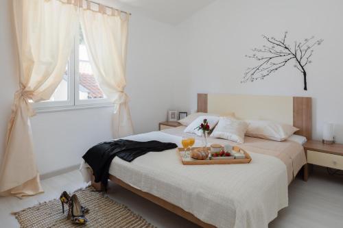 Ένα ή περισσότερα κρεβάτια σε δωμάτιο στο Apartments Babic
