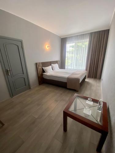 Кровать или кровати в номере Pallada Hotel