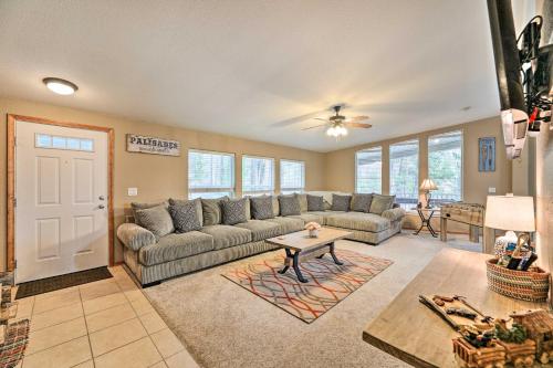 a living room with a couch and a table at Rustic Escape with Deck, Hot Tub and Mountain Views in Irwin