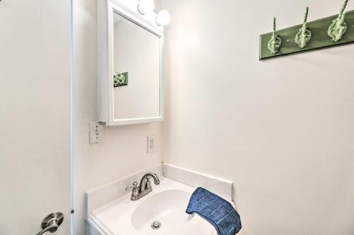 a bathroom with a white sink and a mirror at Atlantic Beach Studio with Community Pool! in Atlantic Beach