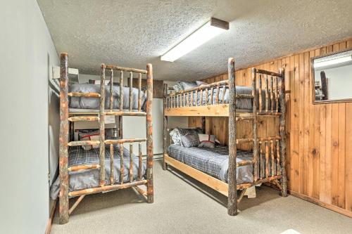 a bedroom with two bunk beds in a room at Walk to Lake and Beach Pocono Cabin with Fire Pit in Pocono Lake