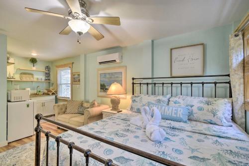 a bedroom with a bed with a stuffed bunny on it at Dreamy, Coastal Studio Paradise with Hot Tub! in Nags Head