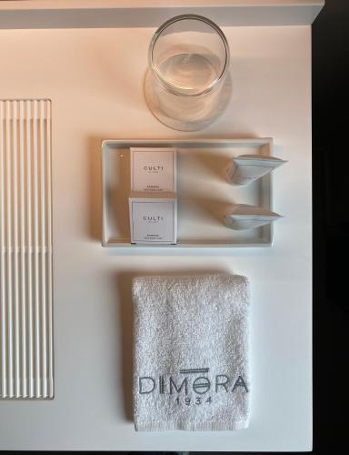 a shelf with a glass bowl and a towel at DIMORA1934 Relax&Comfort in Tirano
