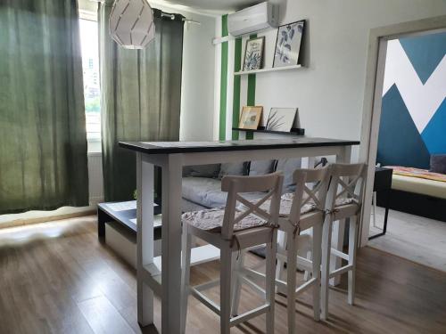 a dining room with a table and two chairs at Arsan home in Cluj-Napoca