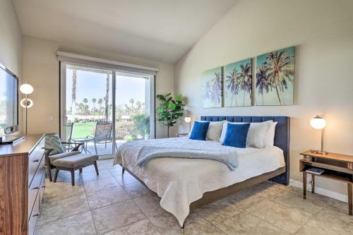 a bedroom with a bed and a desk and a window at Mtn and Golf Course Views Relaxing Palm Desert Gem in Palm Desert