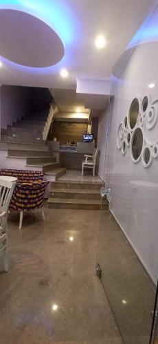 a room with stairs and a bench in a building at moonlight (AY IŞIĞI ) in Canakkale