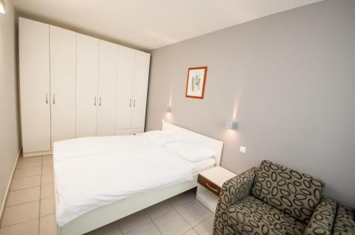 Postel nebo postele na pokoji v ubytování Hotel Mirta