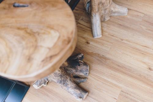a close up of a wooden table with a piece of wood at Spa Chalet by we rent in Zell am See