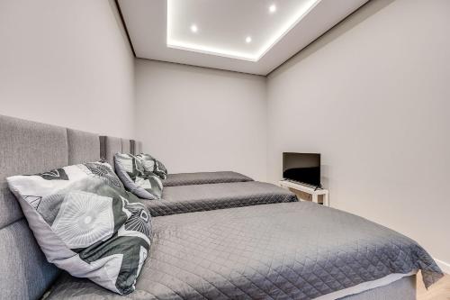 Ένα ή περισσότερα κρεβάτια σε δωμάτιο στο Central Platinum Apartments 29