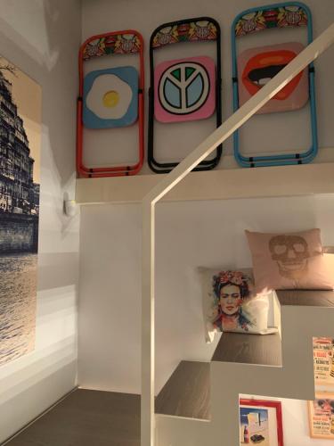 a display case with suitcases on a shelf in a museum at RaRoom Boutique in Torre del Greco