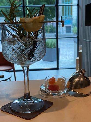 a glass vase sitting on a table with a candle at DIMORA1934 Relax&Comfort in Tirano