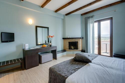 Ένα ή περισσότερα κρεβάτια σε δωμάτιο στο Perivoli Country Hotel & Retreat