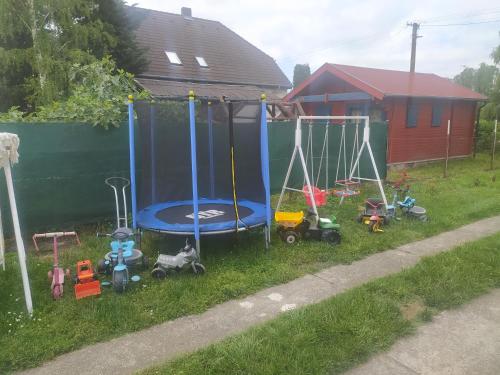 a group of childrens play equipment in a yard at Etus Vendégház in Balatonfenyves