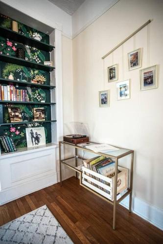 a room with a book shelf filled with books at Charming 1932 Craftsman - The Bohannon House in Luray