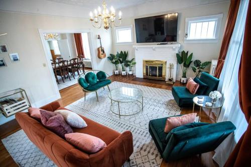 a living room with a couch and chairs and a fireplace at Charming 1932 Craftsman - The Bohannon House in Luray