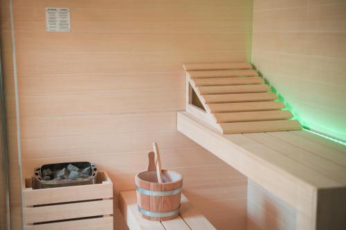 a sauna with wooden walls and a wooden shelf at Royal Palace Hotel in Turin