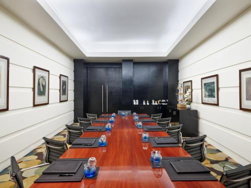 a long conference room with long tables and chairs at Live Aqua Cancun - Adults Only - All-Inclusive in Cancún