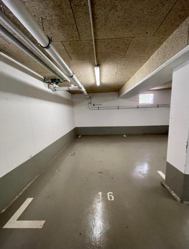 an empty room with an empty parking garage at SEASIDE APARTMENTS - TOWNHOUSE in Eckernförde