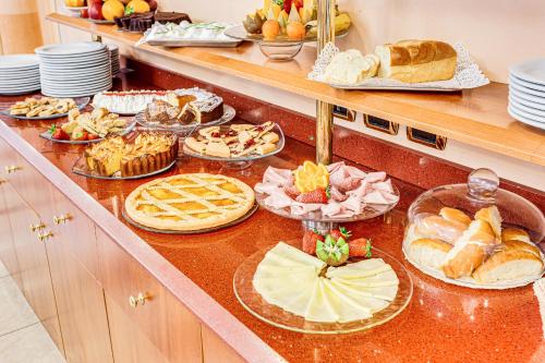 a buffet with many different types of bread and pastries at HOTEL VILLA MARIA in Cesenatico