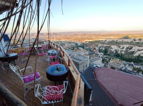 a deck of a pirate ship with chairs and a table at Uchisar Cave House in Uchisar
