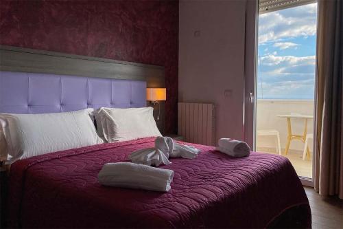 Ένα ή περισσότερα κρεβάτια σε δωμάτιο στο BlueBay Residence Resort