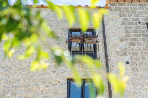 a building with two windows and a balcony at Villa Denise in Vico Equense