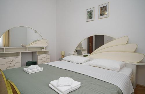 Postel nebo postele na pokoji v ubytování Apartman Rusula Vodice