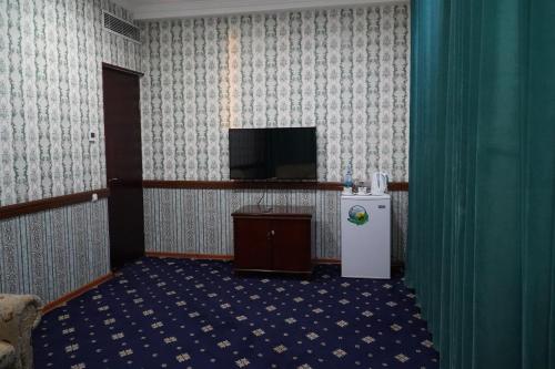 TV a/nebo společenská místnost v ubytování Gulistan Hotel