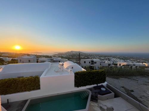 a view of the sunset from the balcony of a house at Elements Cozy Suites Pyrgos in Pirgos