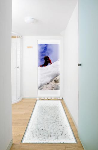 a room with a door with a photo of a person in the snow at Podlesice 38 in Kroczyce