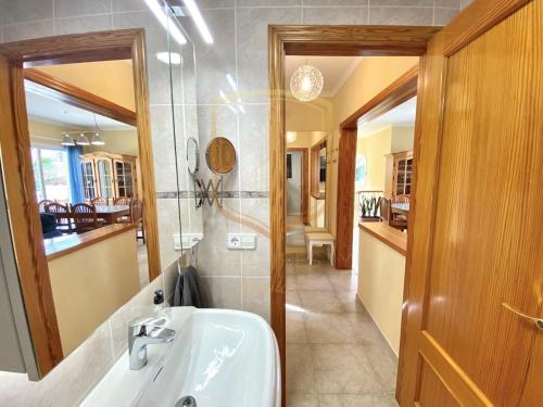 a bathroom with a sink and a mirror at Encantador alojamiento en Altea Hills in Altea