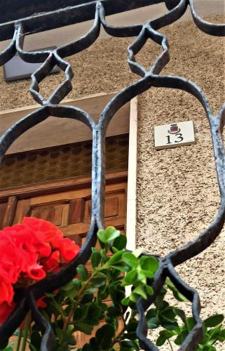 a building with a door with a sign on it at LA CASA DI FRANCESCO in Putifigari