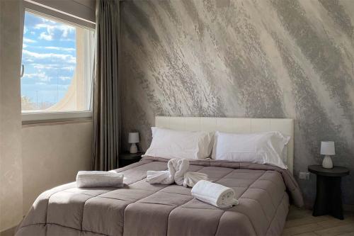 Ένα ή περισσότερα κρεβάτια σε δωμάτιο στο BlueBay Residence Resort
