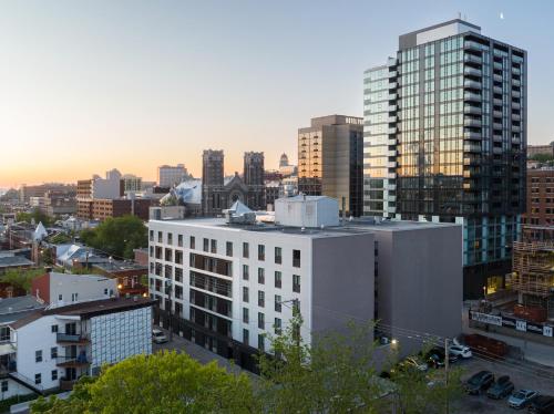 a view of a city with tall buildings at Hôtel Québec Best Western PLUS Centre-Ville - City Center in Quebec City