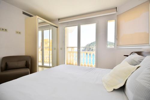 Postel nebo postele na pokoji v ubytování Atico Suite Ola Blanca
