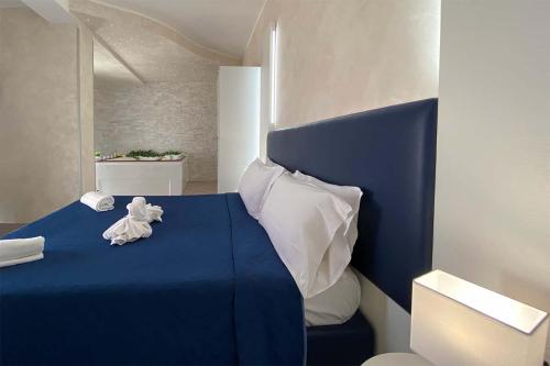Ένα ή περισσότερα κρεβάτια σε δωμάτιο στο BlueBay Residence Resort