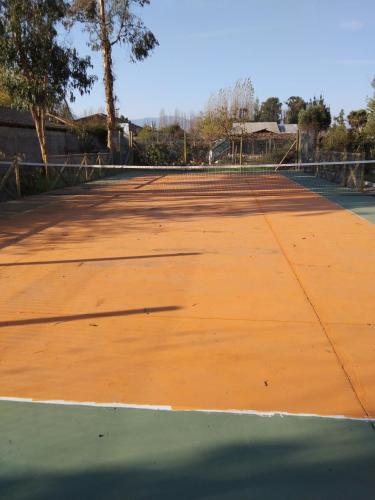 a tennis court with a net on it at Hotel Boutique Grand Cru in Santa Cruz