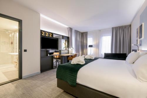 Postel nebo postele na pokoji v ubytování Holiday Inn Hasselt by IHG