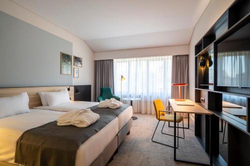 Postel nebo postele na pokoji v ubytování Holiday Inn Hasselt by IHG