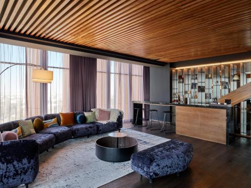 a living room with a couch and a table at Fiesta Americana Viaducto Aeropuerto in Mexico City