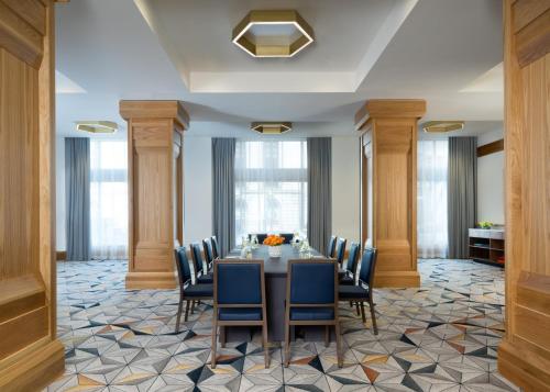a conference room with a table and chairs at Kimpton Schofield Hotel by IHG in Cleveland