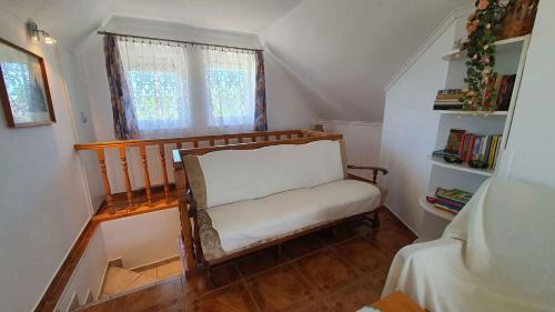 a small room with a chair and a window at Holiday home in Siofok - Balaton 19917 in Siófok