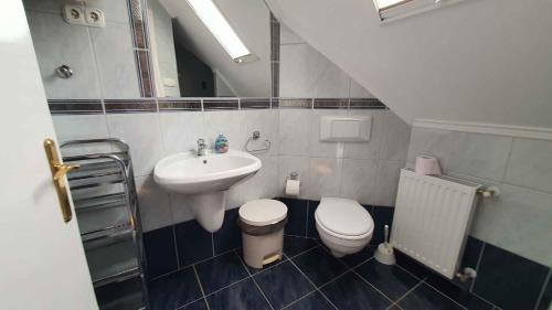 a small bathroom with a sink and a toilet at Holiday home in Siofok - Balaton 19917 in Siófok